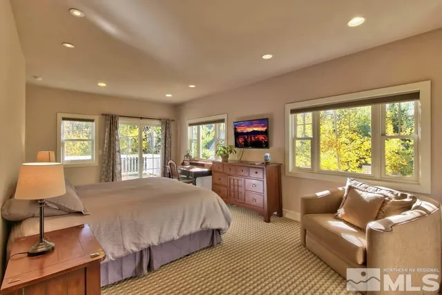 a view of a balcony with a yard