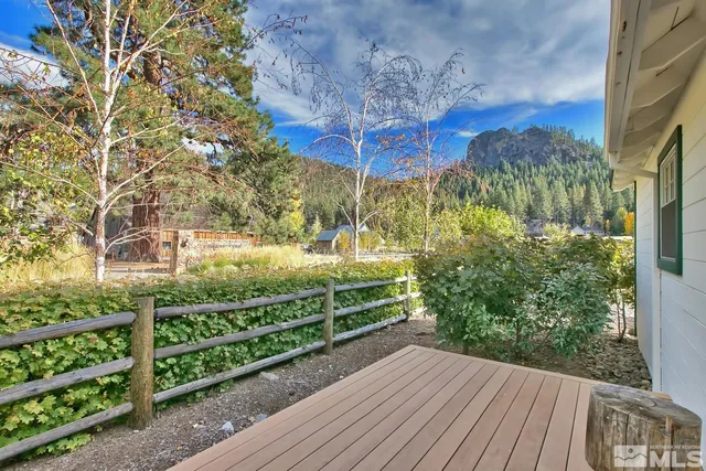 a view of a garden with a building in the background