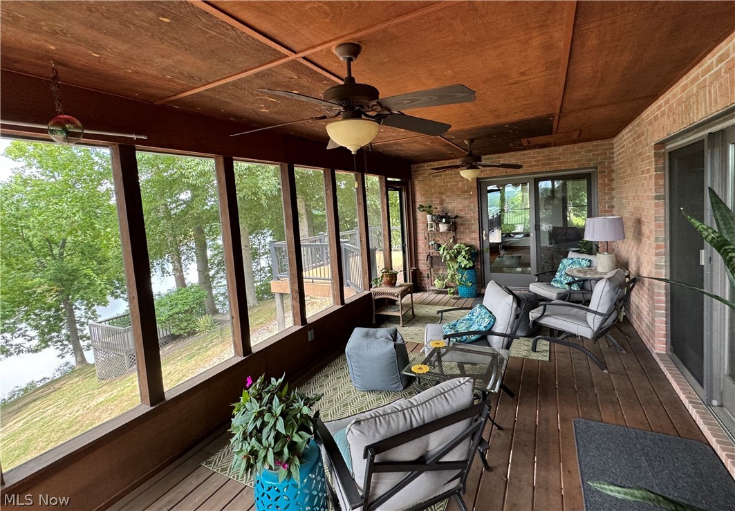 382 Riverview Acres Road Washington, WV 26181 - Photo 18 of 24 Sunroom featuring ceiling fan and wood ceiling
