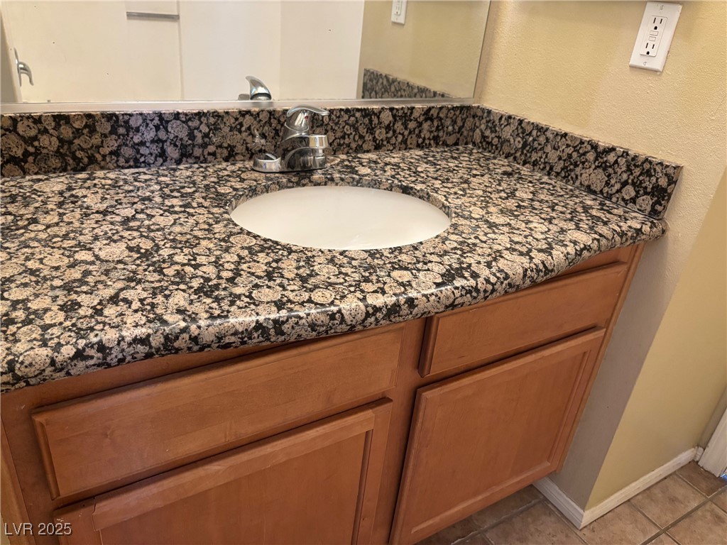 7300 West Pirates Cove Road, Unit 2054 Las Vegas, NV 89145 - Photo 11 of 16 Bathroom with vanity and tile patterned floors