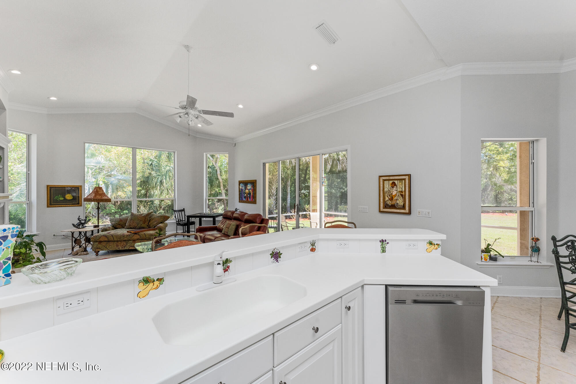 740 Mill Stream Road Ponte Vedra Beach, FL 32082 - Photo 12 of 37 a view of center a kitchen island a sink a counter top space and living room