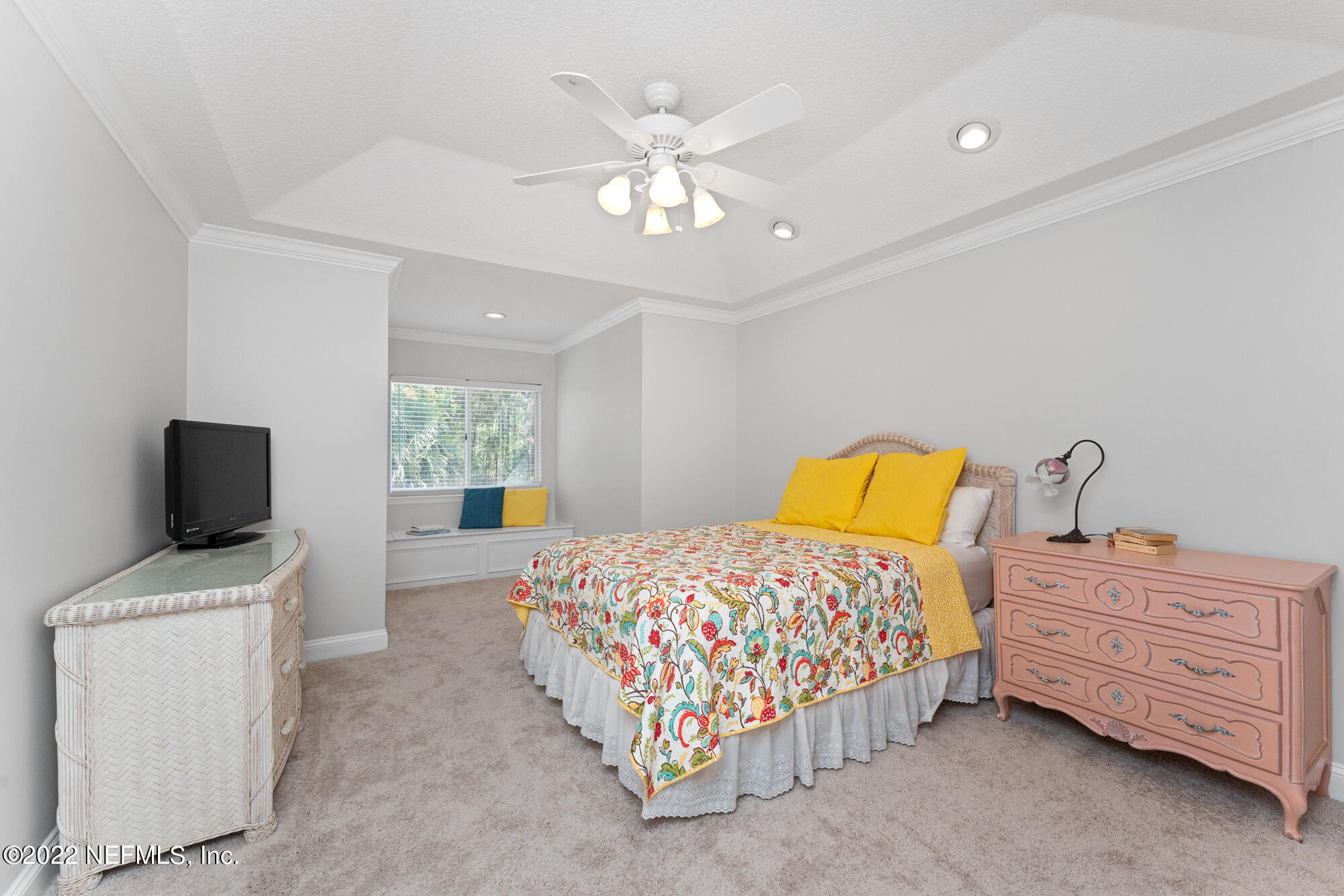 740 Mill Stream Road Ponte Vedra Beach, FL 32082 - Photo 19 of 37 a bedroom with a bed a couch and a flat tv screen on the dresser
