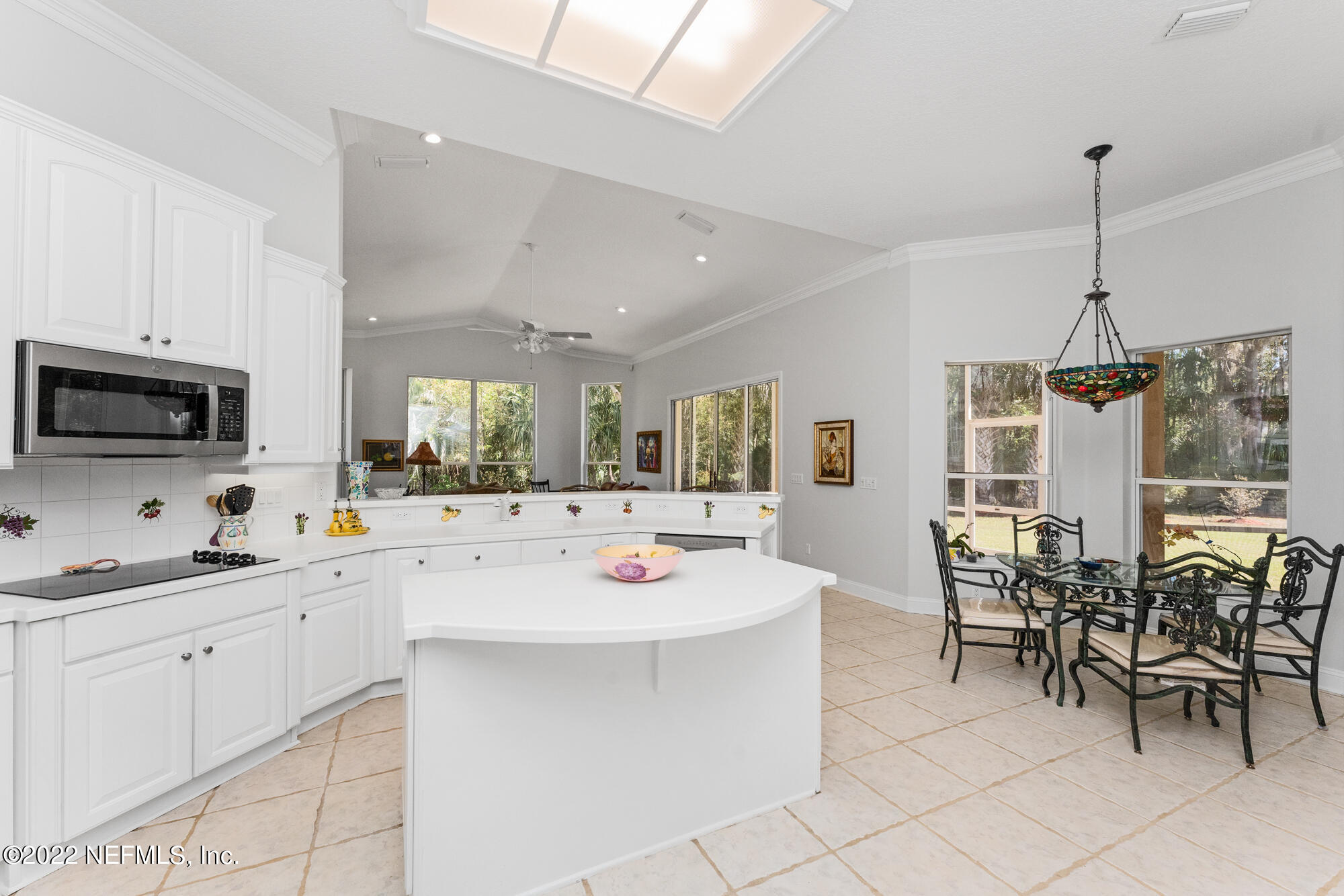 740 Mill Stream Road Ponte Vedra Beach, FL 32082 - Photo 7 of 37 a kitchen with stainless steel appliances kitchen island granite countertop a sink and a stove