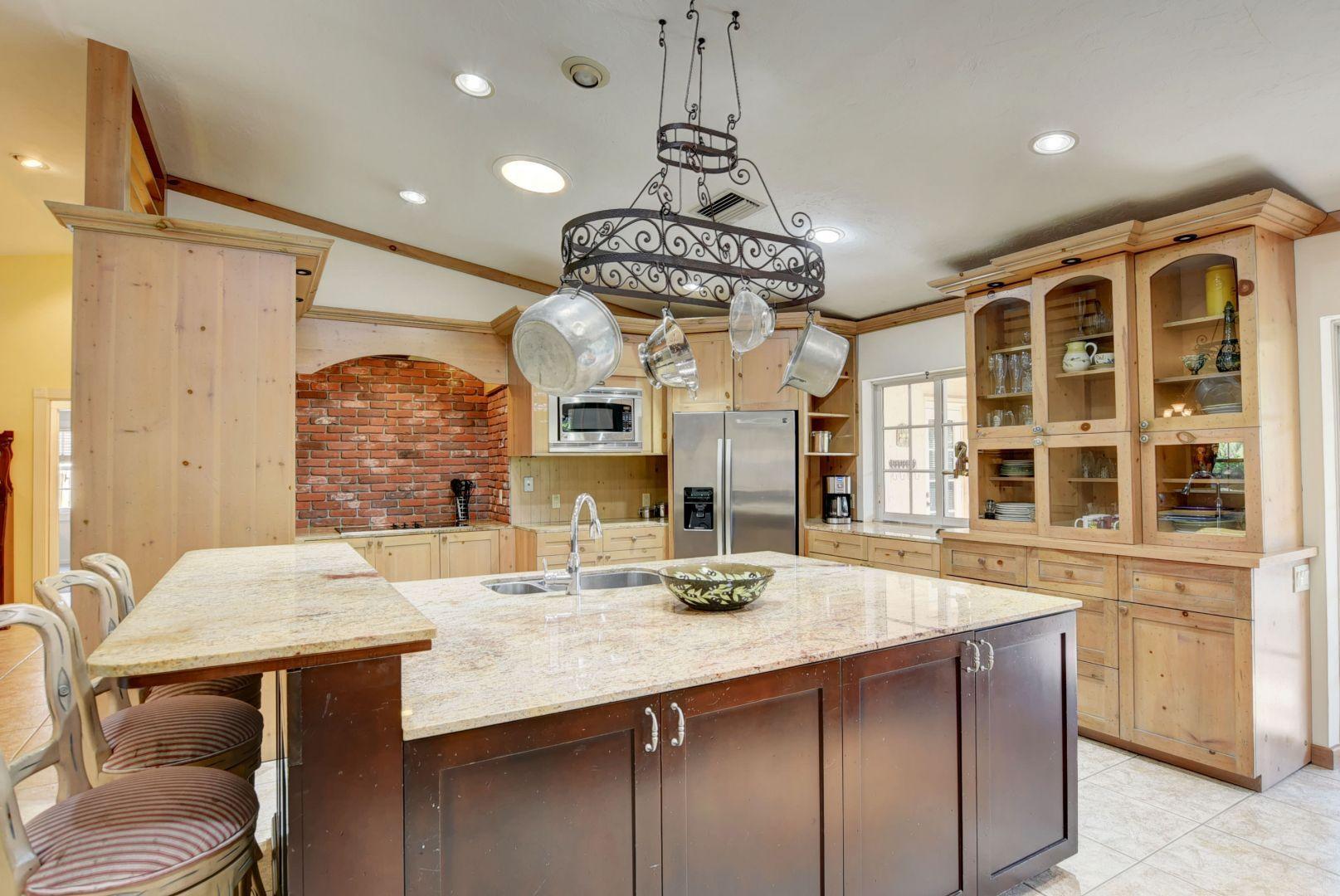 2068 Southwest 8th Avenue Boca Raton, FL 33486 - Photo 11 of 35 a kitchen with a table and chairs in it
