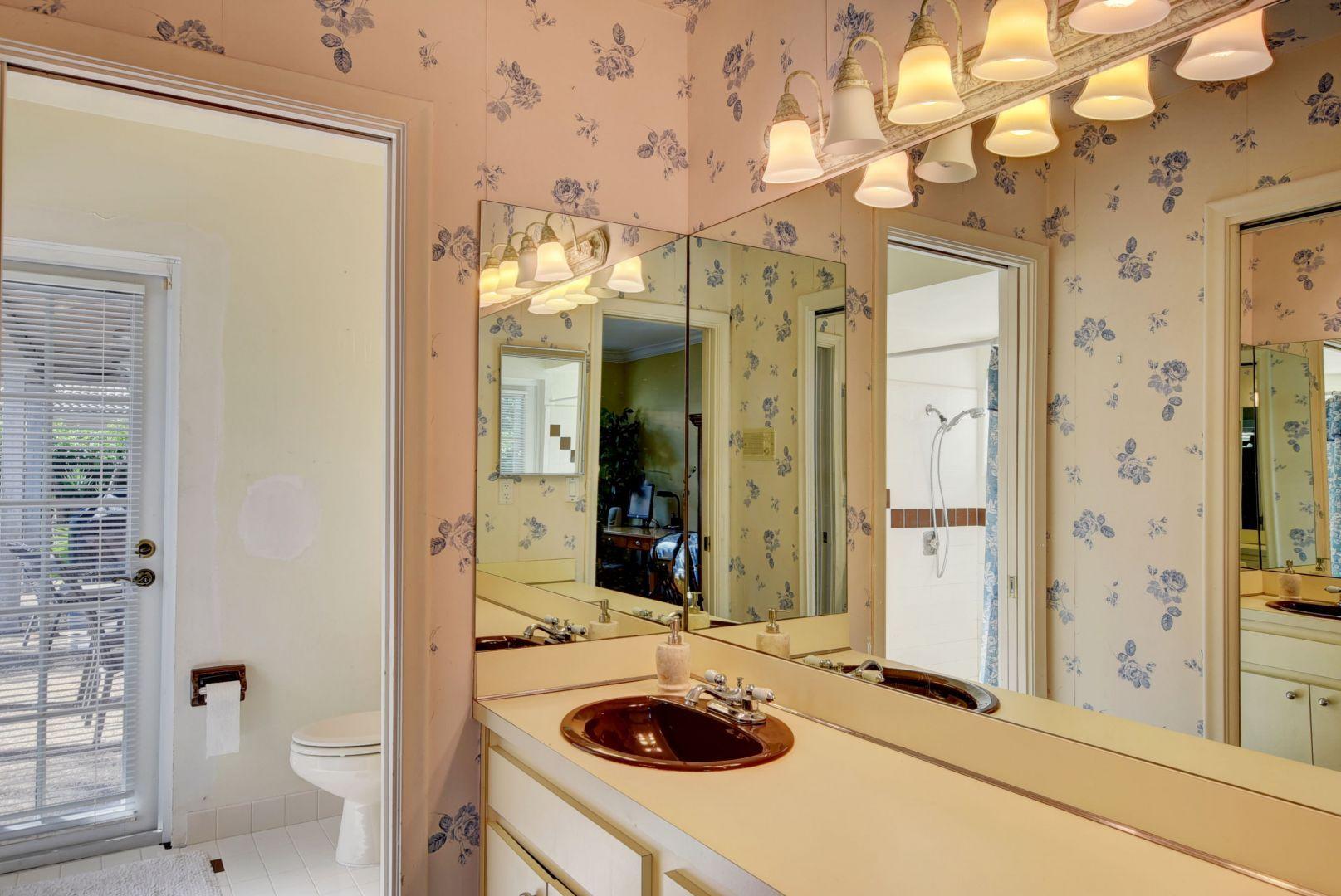 2068 Southwest 8th Avenue Boca Raton, FL 33486 - Photo 17 of 35 a bathroom with a sink a toilet and shower