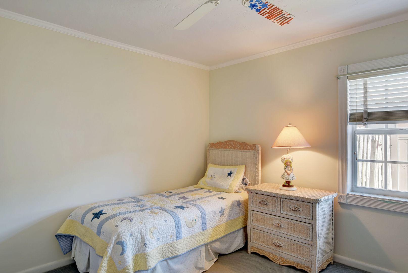 2068 Southwest 8th Avenue Boca Raton, FL 33486 - Photo 23 of 35 a bedroom with a bed and window