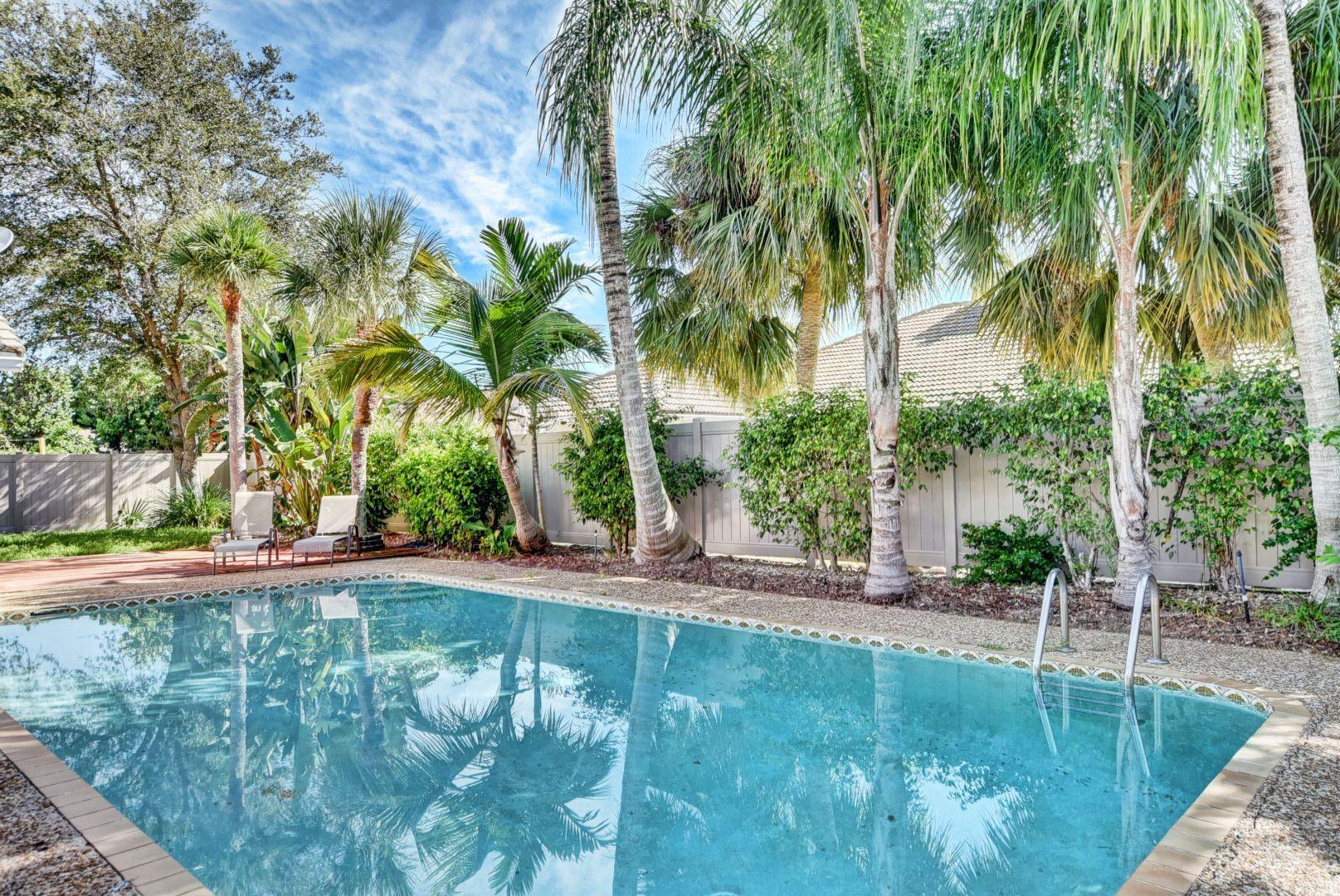 2068 Southwest 8th Avenue Boca Raton, FL 33486 - Photo 26 of 35 a view of a backyard patio and swimming pool