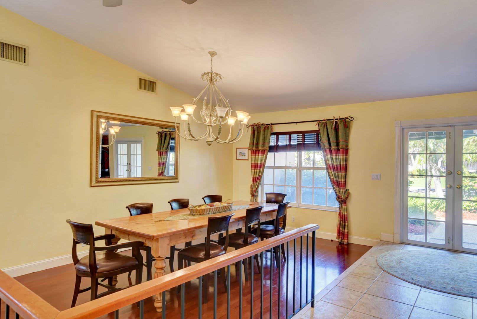 2068 Southwest 8th Avenue Boca Raton, FL 33486 - Photo 4 of 35 a view of a dining room with furniture and chandelier