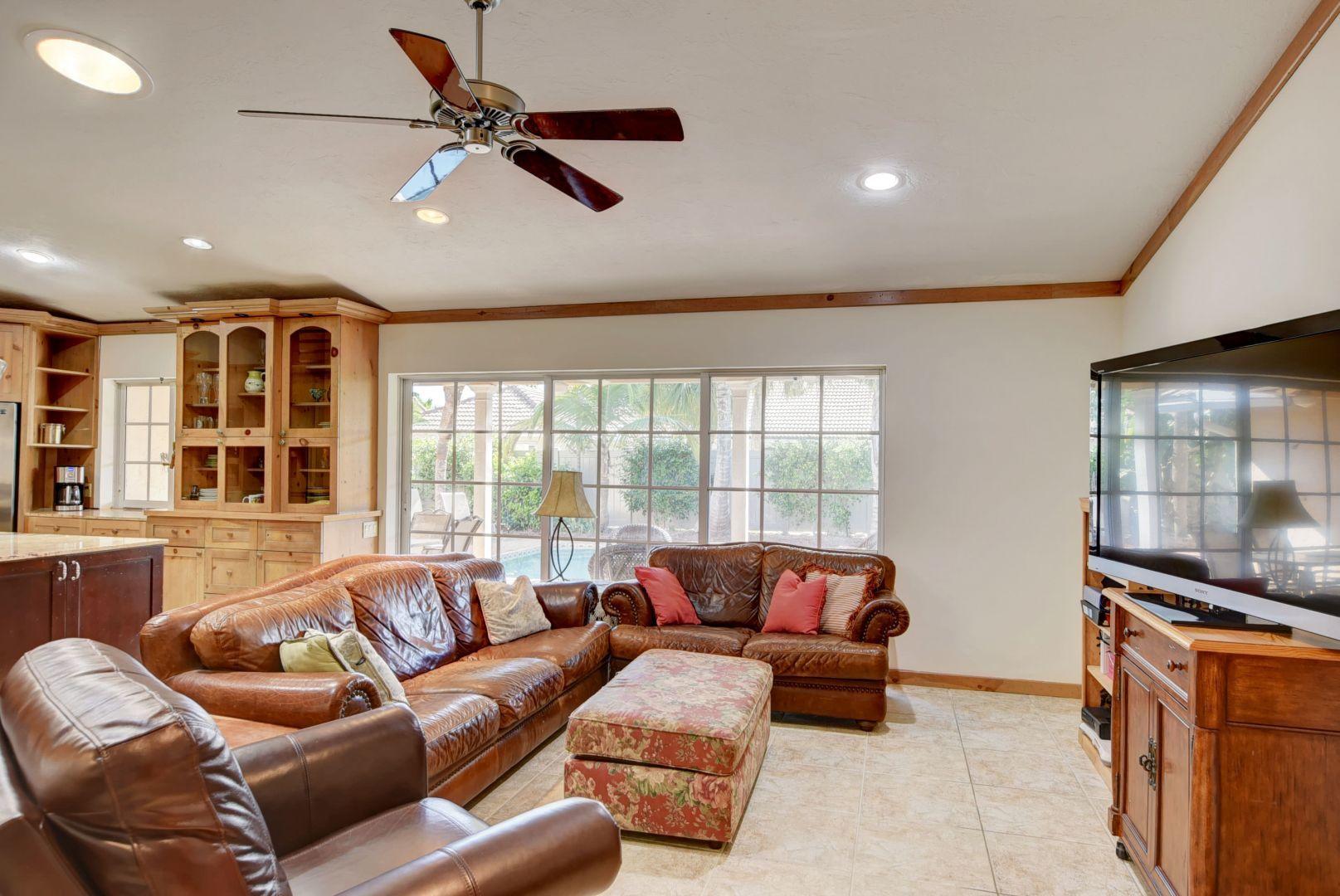 2068 Southwest 8th Avenue Boca Raton, FL 33486 - Photo 10 of 35 a living room with furniture and a flat screen tv