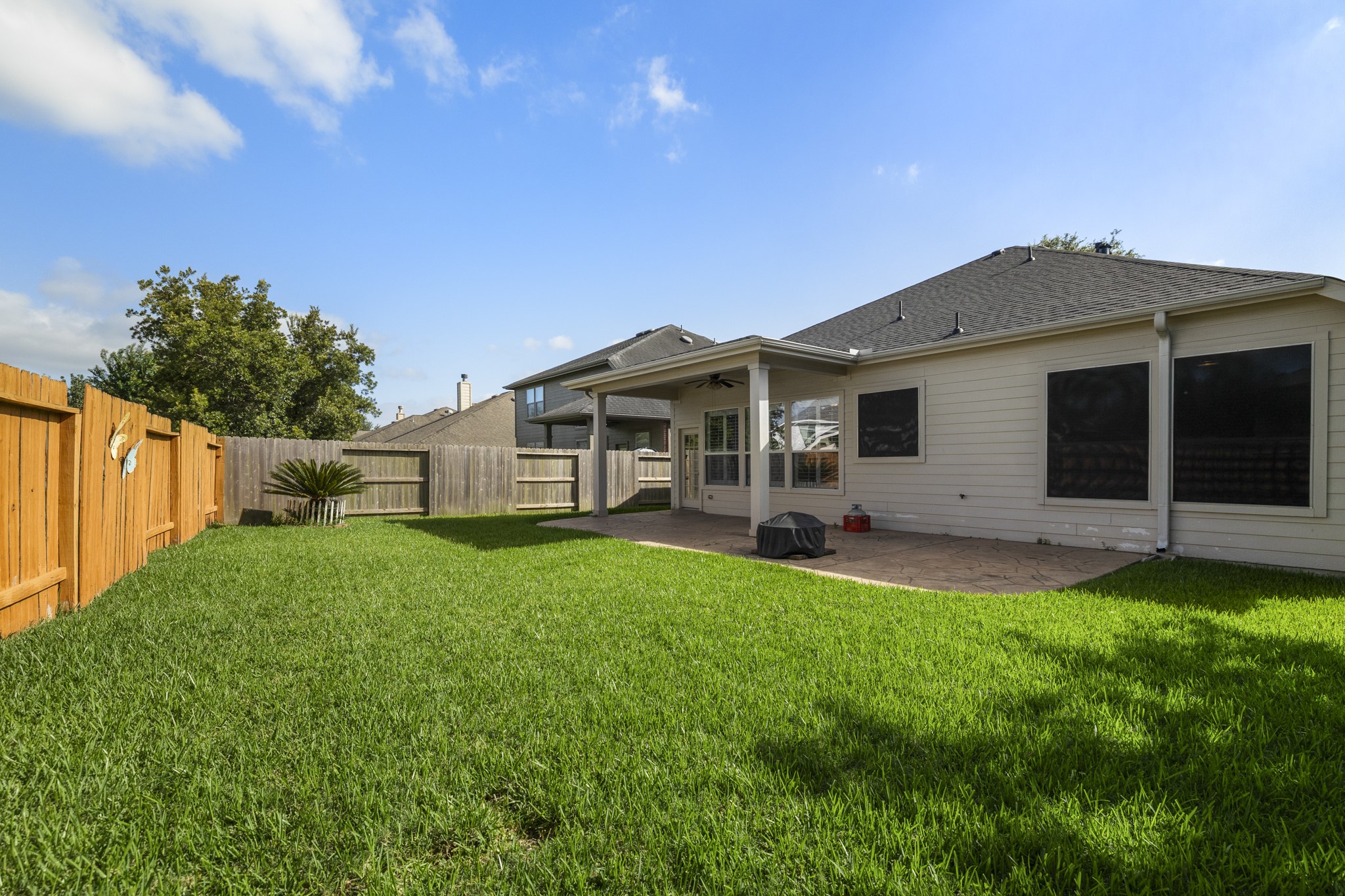 20014 Queens Oak Court Spring, TX 77379 - Photo 30 of 49 a view of a house with a backyard
