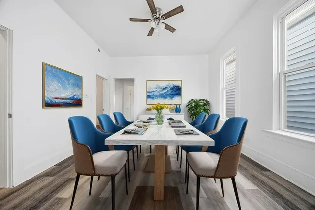 a view of a dining room with furniture window and wooden floor