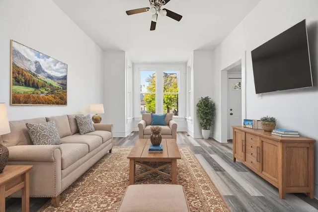 a living room with furniture and a flat screen tv