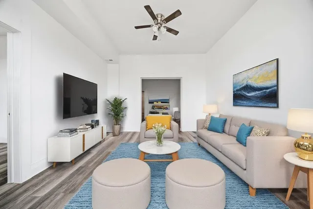 a living room with furniture and a flat screen tv