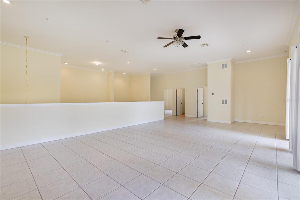 2718 Knightsbridge Road Clermont, FL 34711 - Photo 14 of 72 a view of a livingroom with a ceiling fan and window