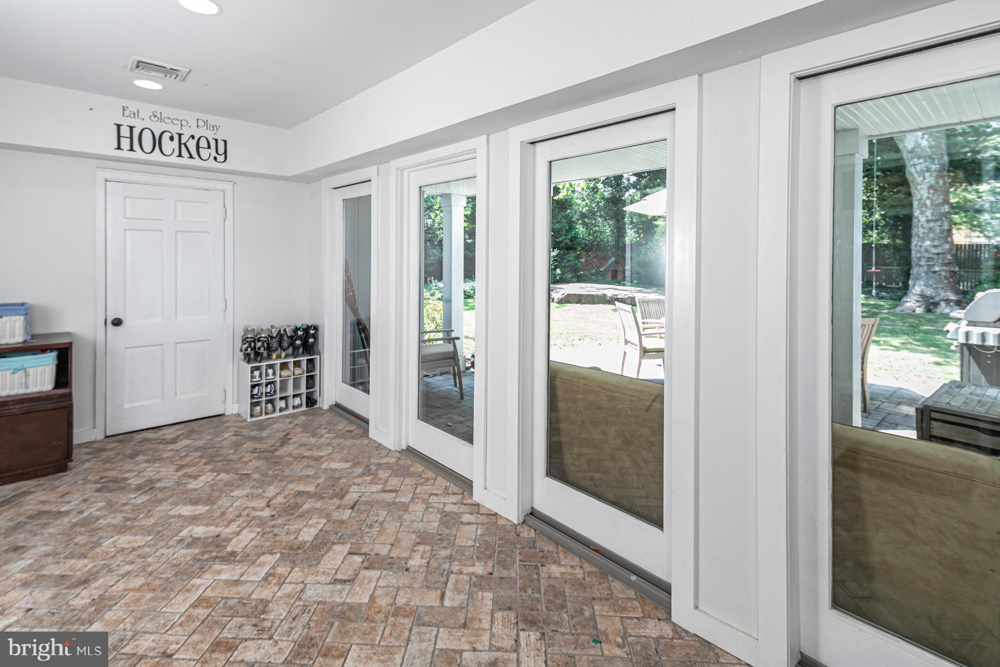 14 Riverside Drive Princeton, NJ 08540 - Photo 18 of 31 Mudroom w/Wall of Cubbies, Garage Door, & Patio
