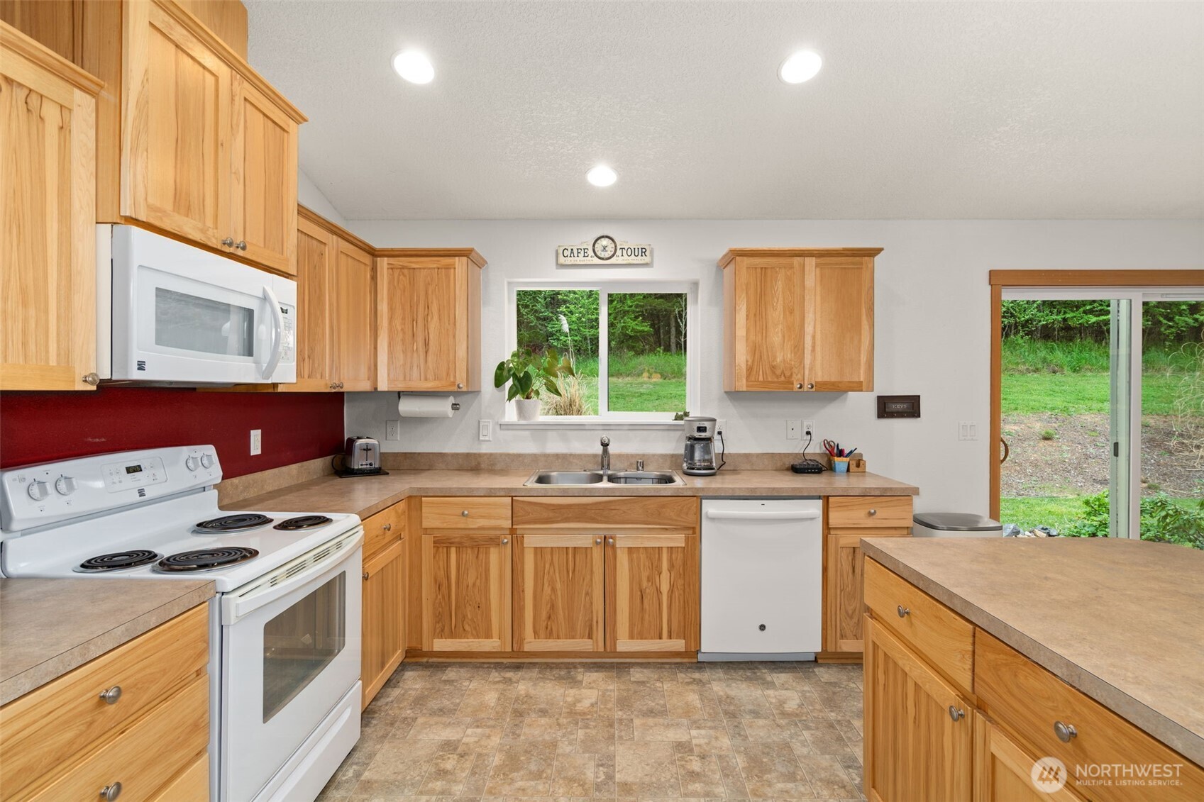 236 Chilvers Road Chehalis, WA 98532 - Photo 3 of 39 a kitchen with a stove sink and cabinets
