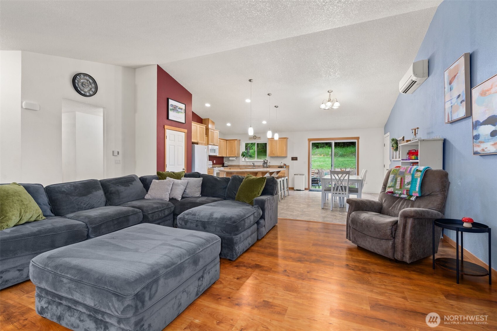 236 Chilvers Road Chehalis, WA 98532 - Photo 8 of 39 a living room with furniture kitchen view and a wooden floor