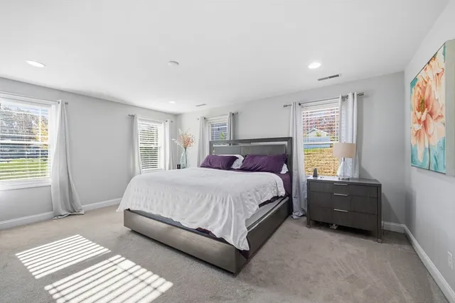 a bathroom with a granite countertop sink a shower and a mirror