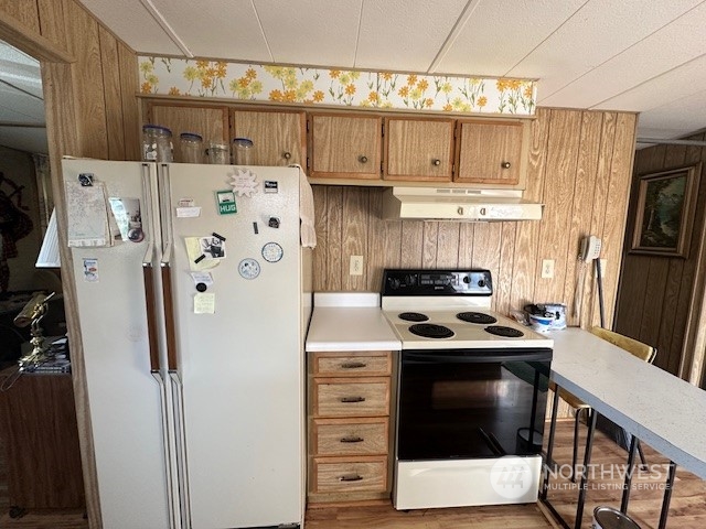 491 Mill Road, Unit 36 Sequim, WA 98382 - Photo 11 of 21 a kitchen with stainless steel appliances a stove a refrigerator and cabinets