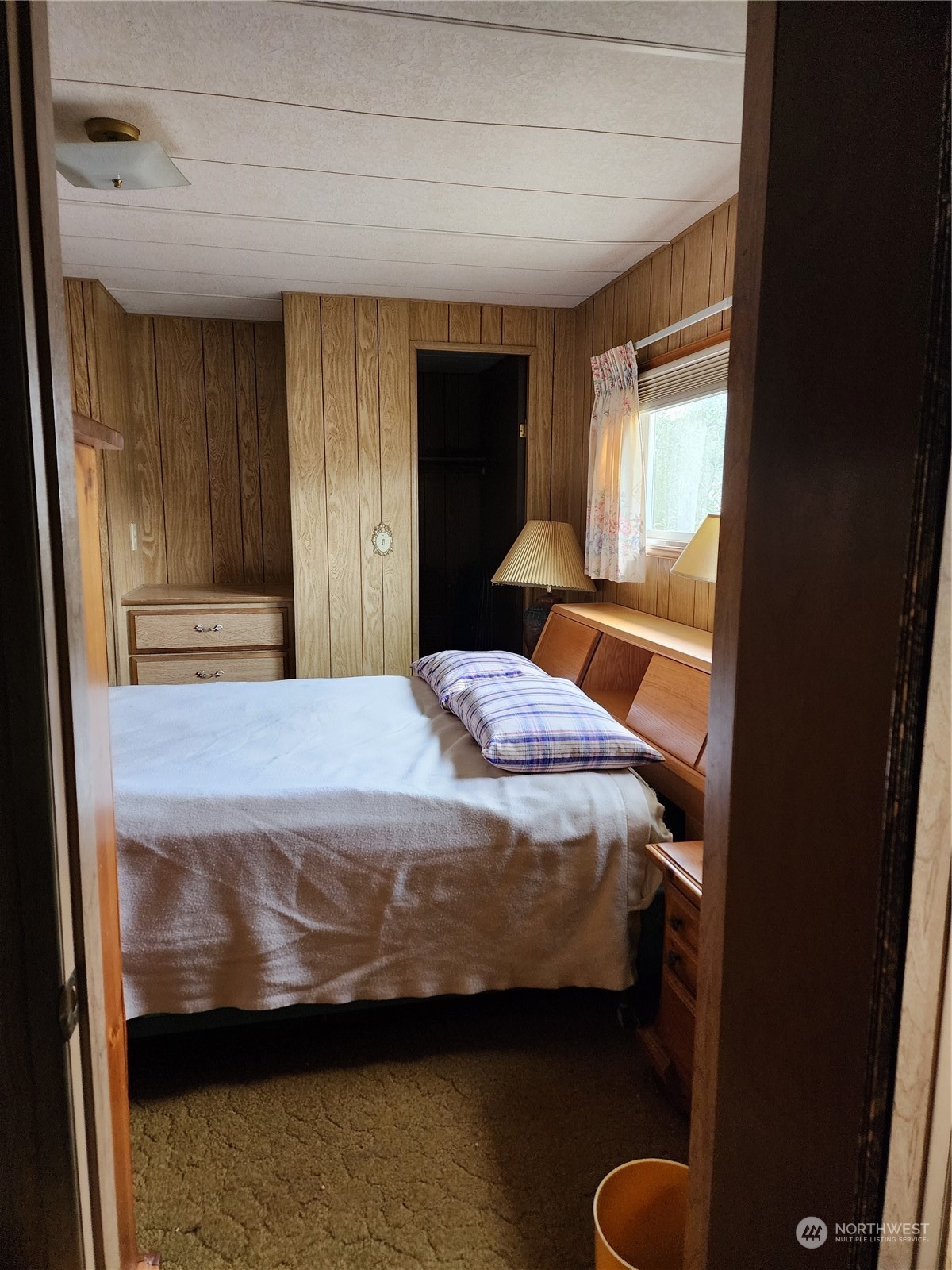 491 Mill Road, Unit 36 Sequim, WA 98382 - Photo 16 of 21 a bedroom with a bed and a window