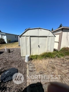 491 Mill Road, Unit 36 Sequim, WA 98382 - Photo 5 of 21 a backyard of a house with a yard and outdoor seating