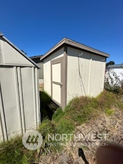 491 Mill Road, Unit 36 Sequim, WA 98382 - Photo 6 of 21 a view of a house with backyard
