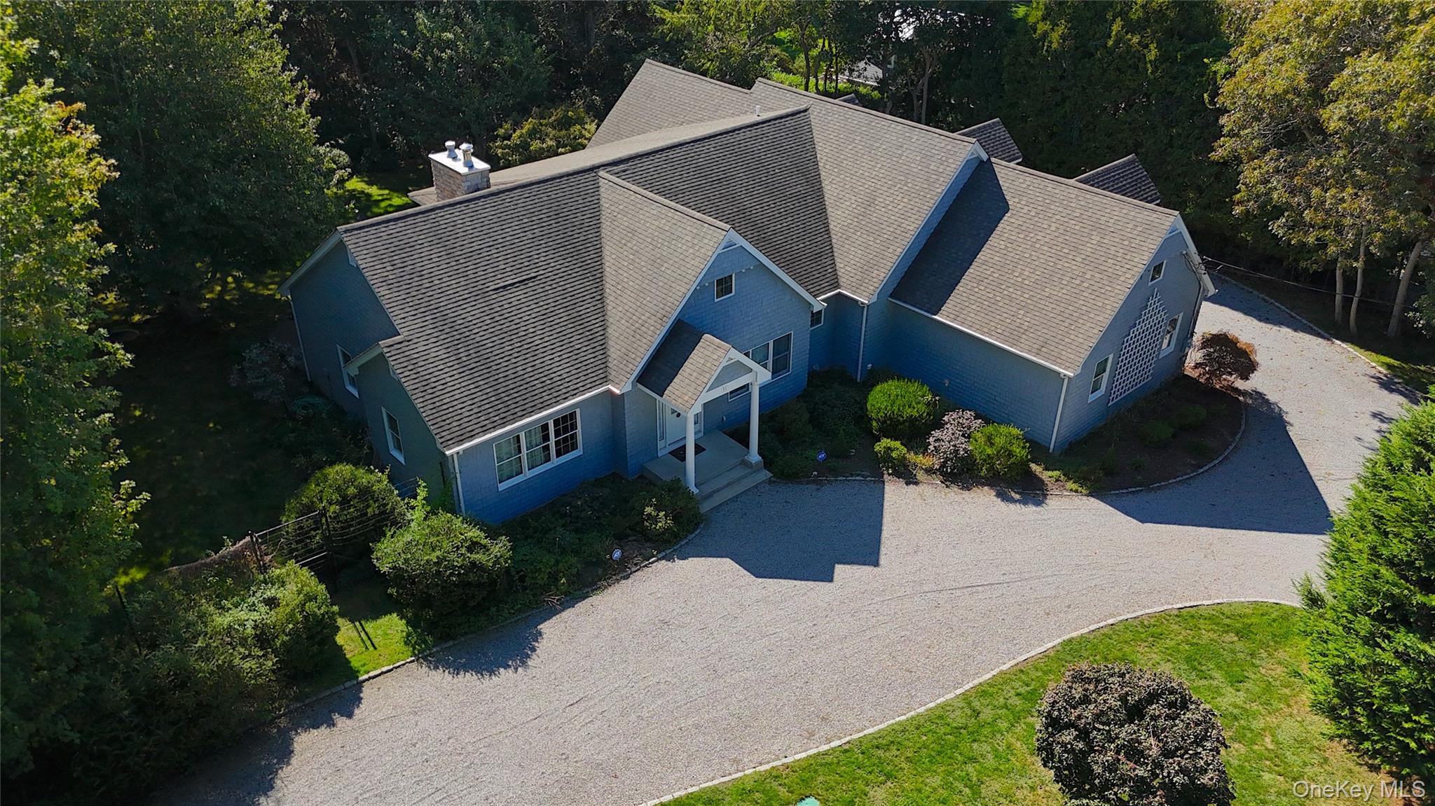 71 Sebonac Inlet Road Southampton, NY 11968 - Photo 2 of 6 Bird's eye view of a tree filled landscape