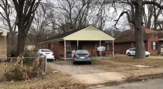 a view of a car parked in front of house