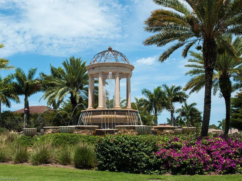 9727 Acqua Court, Unit 427 Naples, FL 34113 - Photo 3 of 29 a front view of a house with a yard