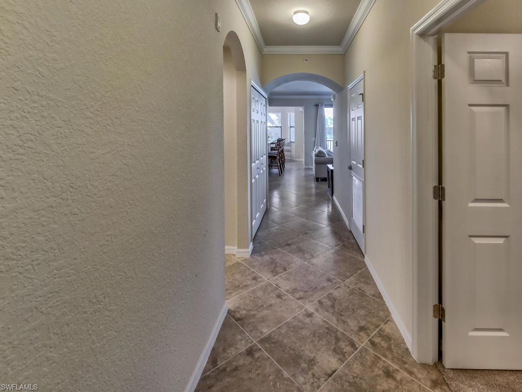 9727 Acqua Court, Unit 427 Naples, FL 34113 - Photo 5 of 29 a view of a hallway with a livingroom and a hallway