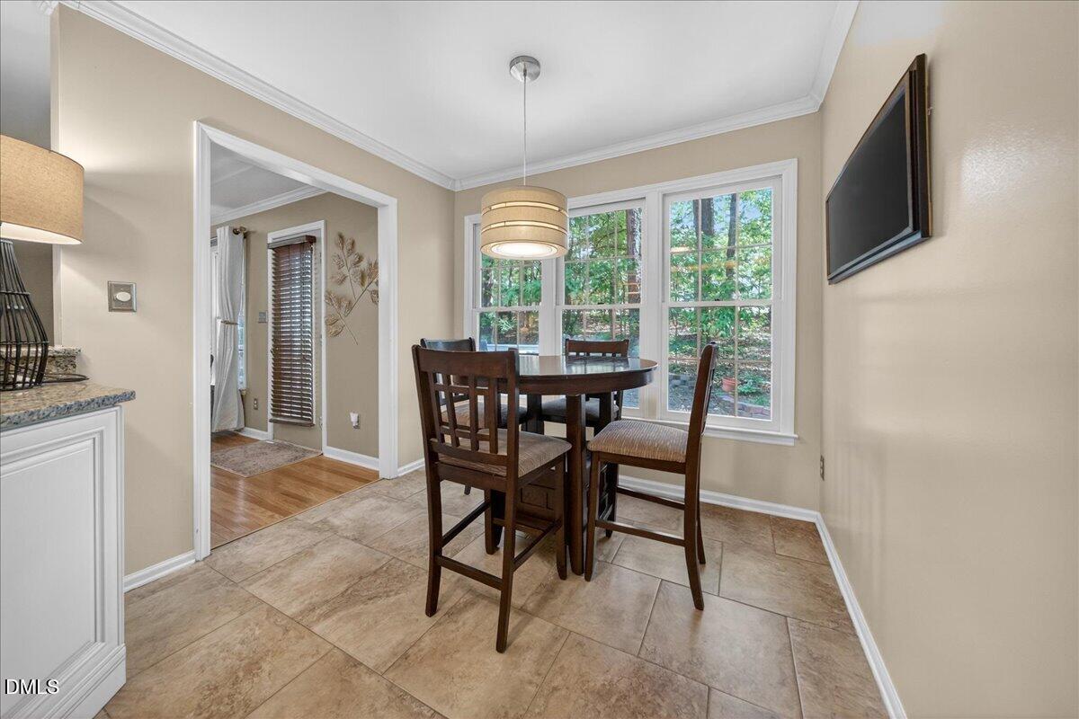 9536 Bells Valley Drive Raleigh, NC 27617 - Photo 12 of 39 a dining room with furniture window and outside view