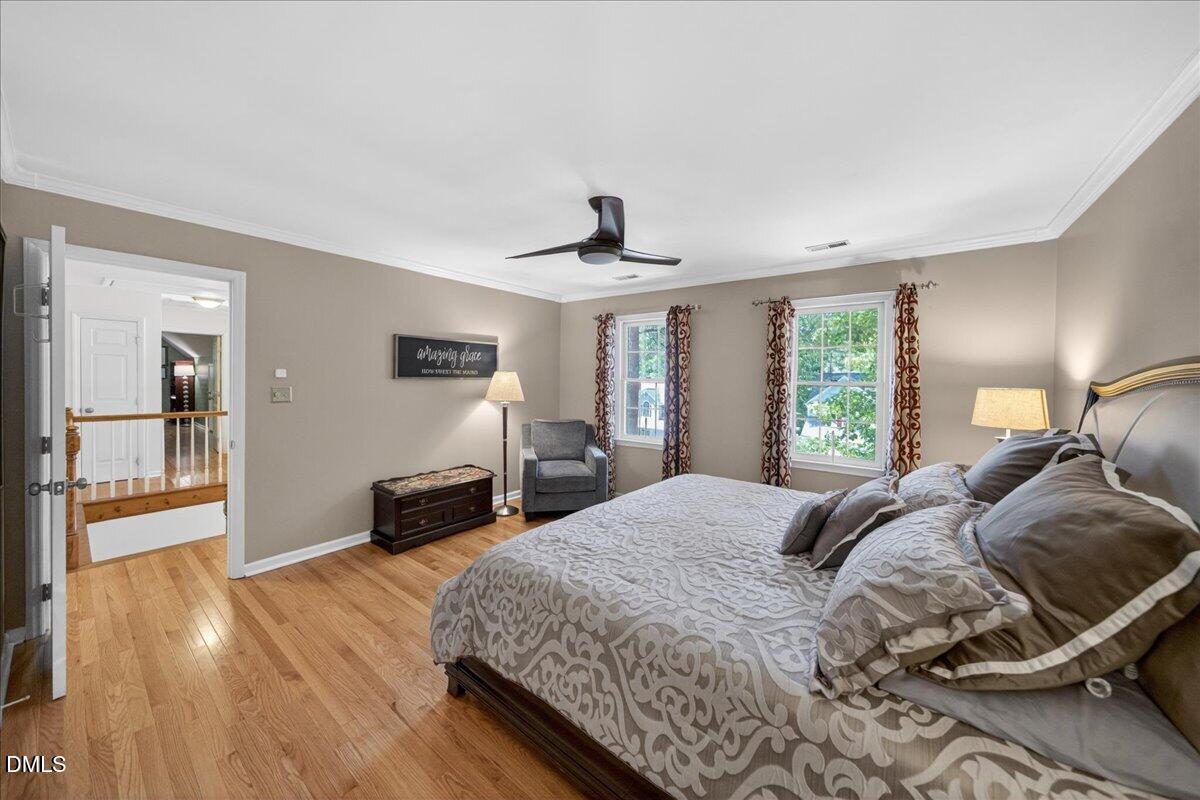 9536 Bells Valley Drive Raleigh, NC 27617 - Photo 22 of 39 a living room with a bed furniture and a flat screen tv