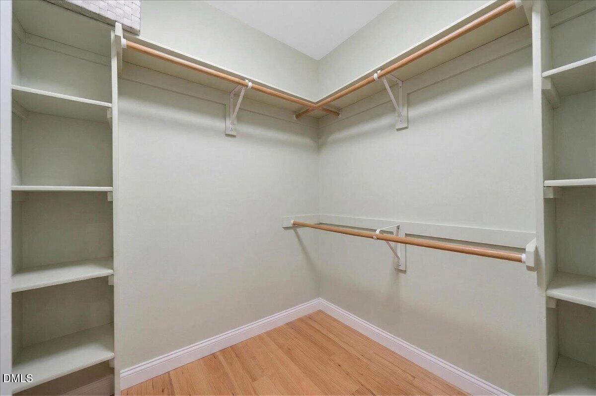 9536 Bells Valley Drive Raleigh, NC 27617 - Photo 24 of 39 a view of a room with racks on the wall