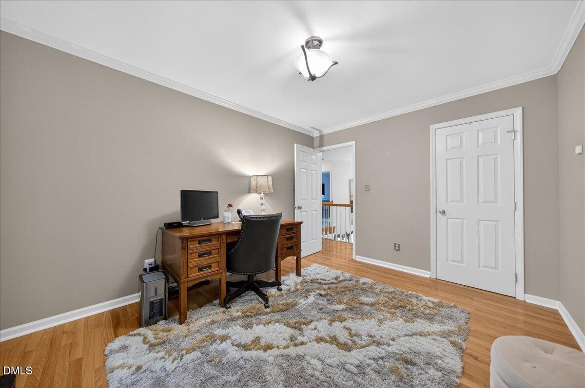 9536 Bells Valley Drive Raleigh, NC 27617 - Photo 29 of 39 a view of a workspace with furniture