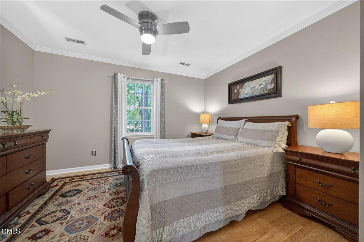 9536 Bells Valley Drive Raleigh, NC 27617 - Photo 30 of 39 a bedroom with a bed and window