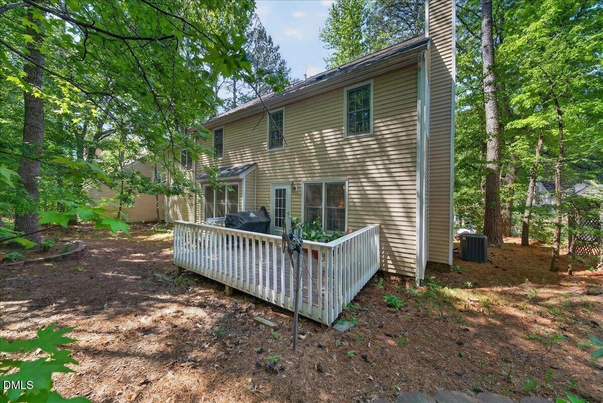 9536 Bells Valley Drive Raleigh, NC 27617 - Photo 36 of 39 a view of a house with a yard and deck