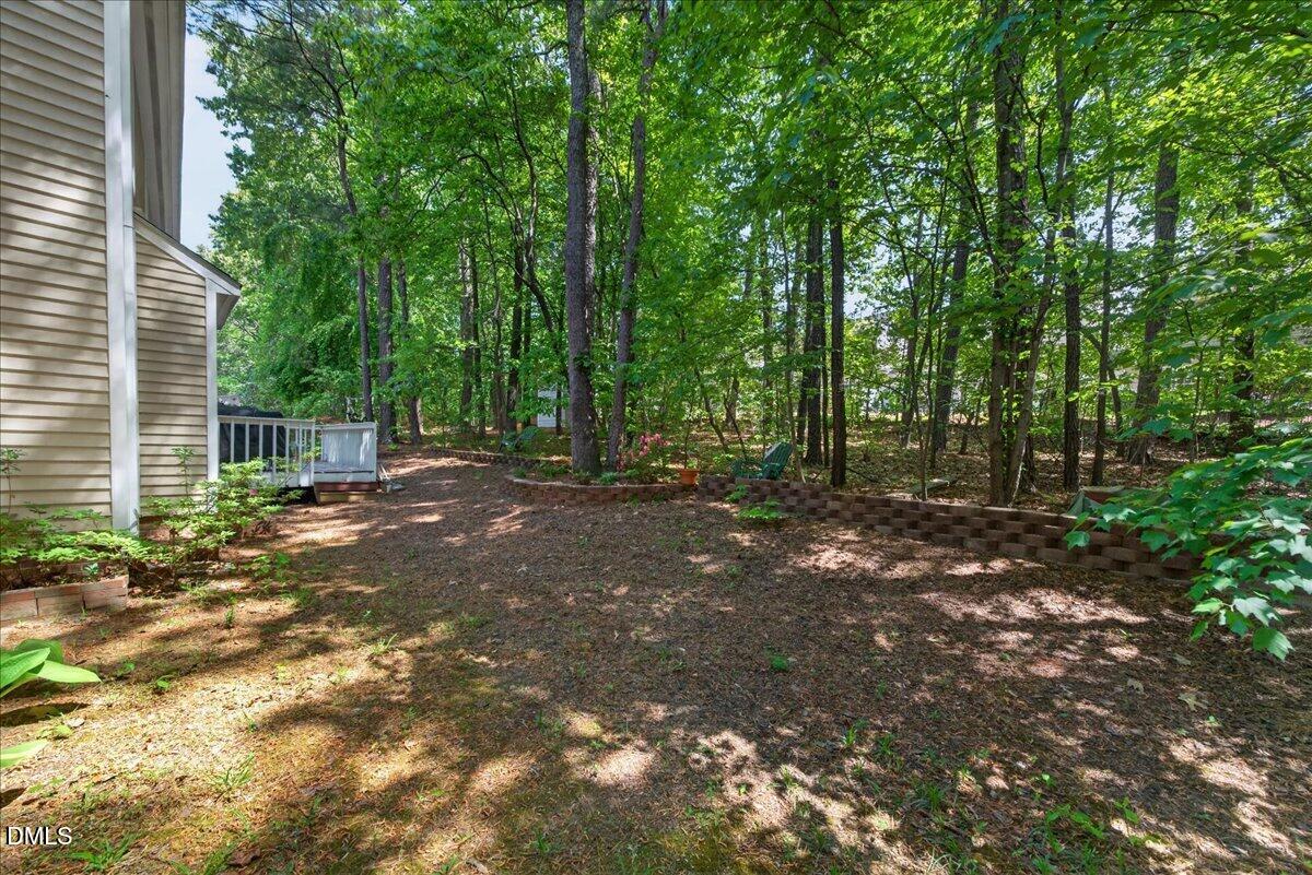 9536 Bells Valley Drive Raleigh, NC 27617 - Photo 39 of 39 a view of a tree in the middle of a yard