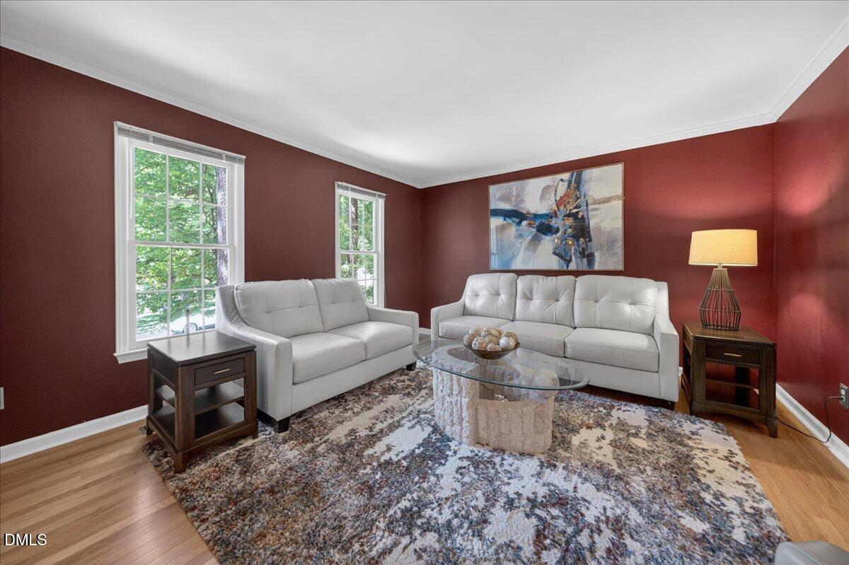 9536 Bells Valley Drive Raleigh, NC 27617 - Photo 7 of 39 a living room with furniture and a large window