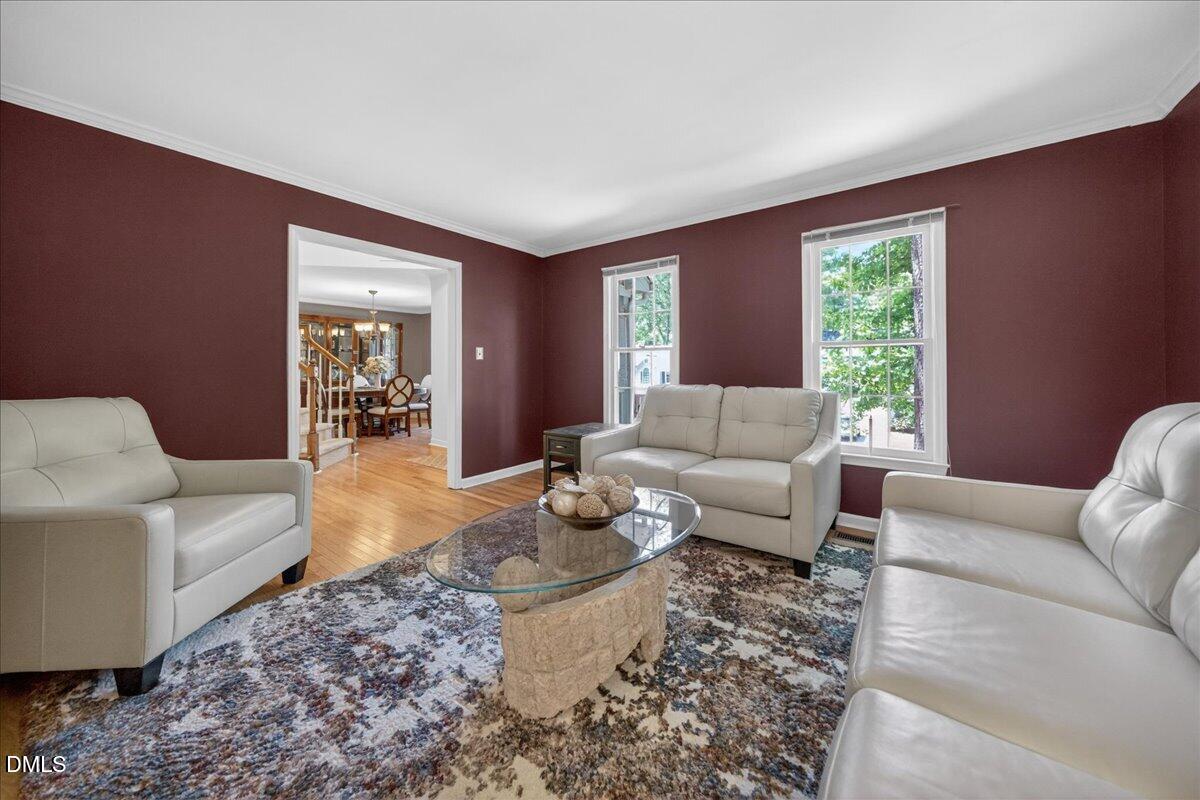 9536 Bells Valley Drive Raleigh, NC 27617 - Photo 8 of 39 a living room with furniture and a large window