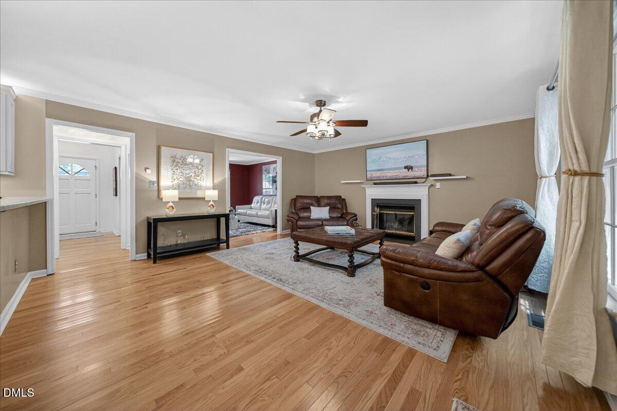 9536 Bells Valley Drive Raleigh, NC 27617 - Photo 10 of 39 a living room with furniture and a fireplace