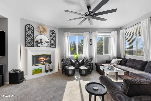 a bathroom with a granite countertop sink a toilet and a mirror