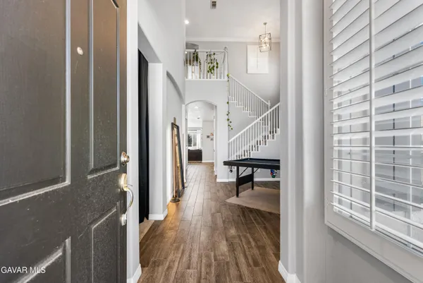 a view of a livingroom with furniture window and wooden floor