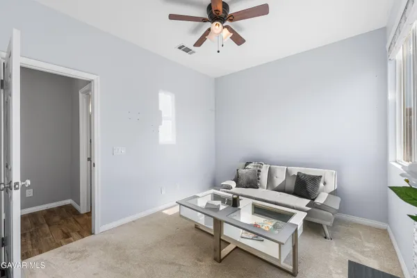 a view of a house with swimming pool and sitting area