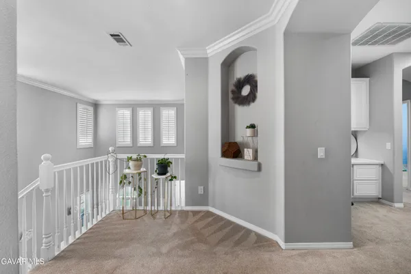 an aerial view of a house with a garden and lake view