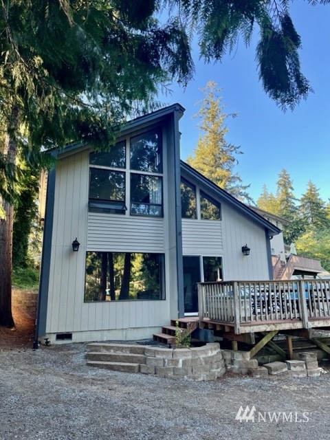 2330 East Phillips Lake Loop Road Shelton, WA 98584 - Photo 1 of 1 a front view of a house with deck