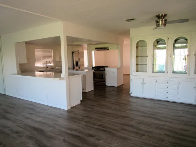 a view of a living room with hardwood floor