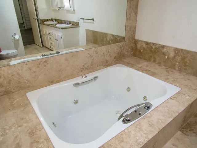 a bath tub sitting in a bathroom