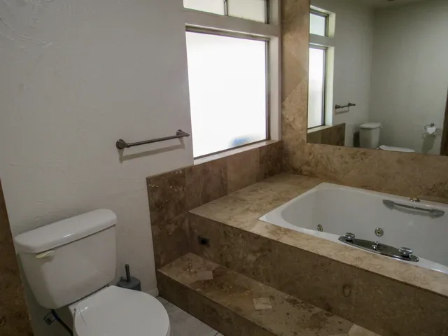 a bathroom with a sink a toilet and a bathtub