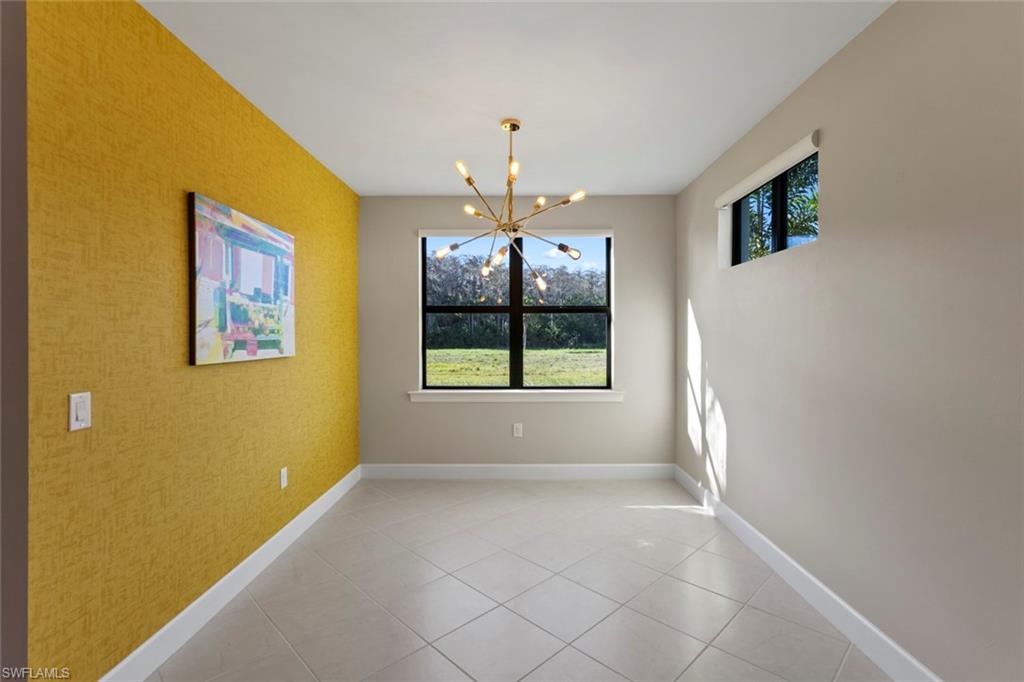 5701 Mayflower Way, Unit 1302 Ave Maria, FL 34142 - Photo 11 of 32 a view of livingroom with window