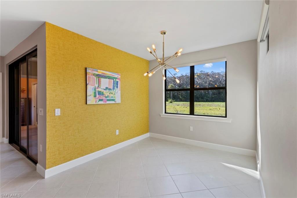 5701 Mayflower Way, Unit 1302 Ave Maria, FL 34142 - Photo 12 of 32 a view of livingroom with window